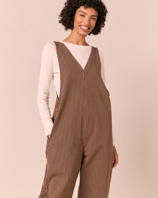 model wears ottie nutmeg pinstripe denim jumpsuit