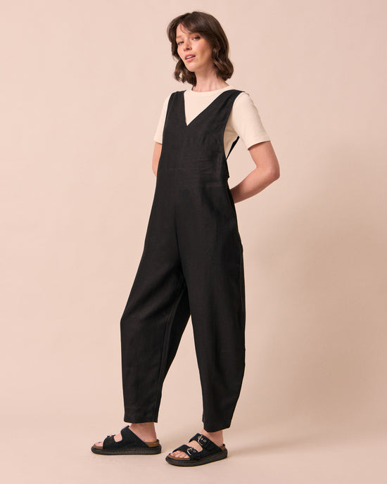 model wears ottie black linen jumpsuit