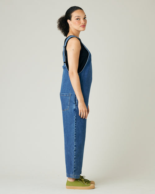 model wears mid blue denim ottie jumpsuit