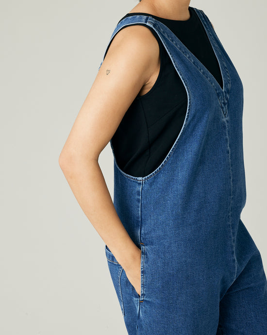 model wears mid blue denim ottie jumpsuit