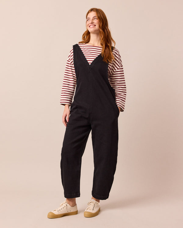 model wears ottie black denim jumpsuit