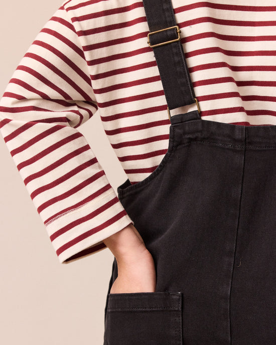 model wears ottie black denim jumpsuit