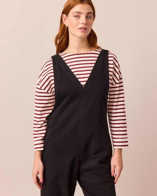 model wears ottie black denim jumpsuit