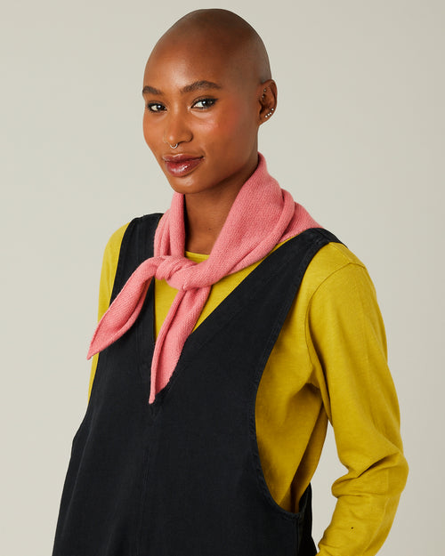 model wears dusty pink knitted neckerchief