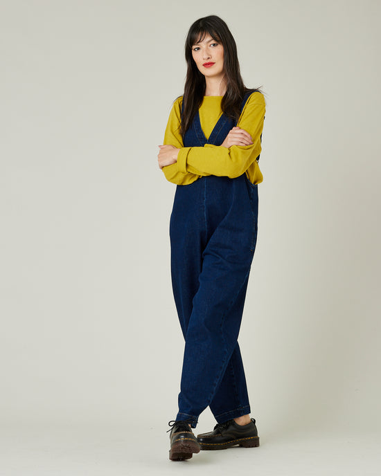 model wears dark wash ottie jumpsuit