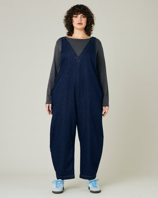 model wears dark wash ottie jumpsuit