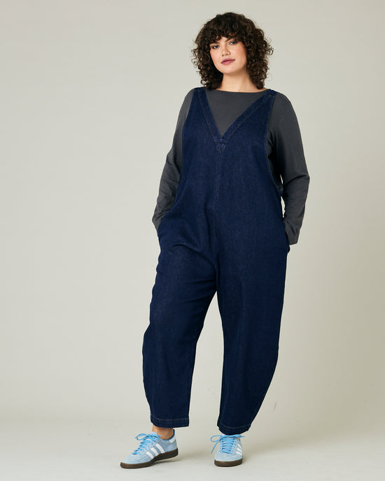 model wears dark wash ottie jumpsuit