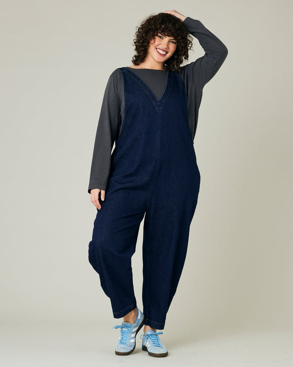 model wears dark wash ottie jumpsuit