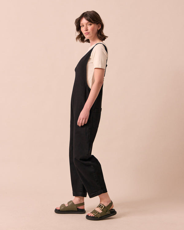 model wears ottie black denim jumpsuit
