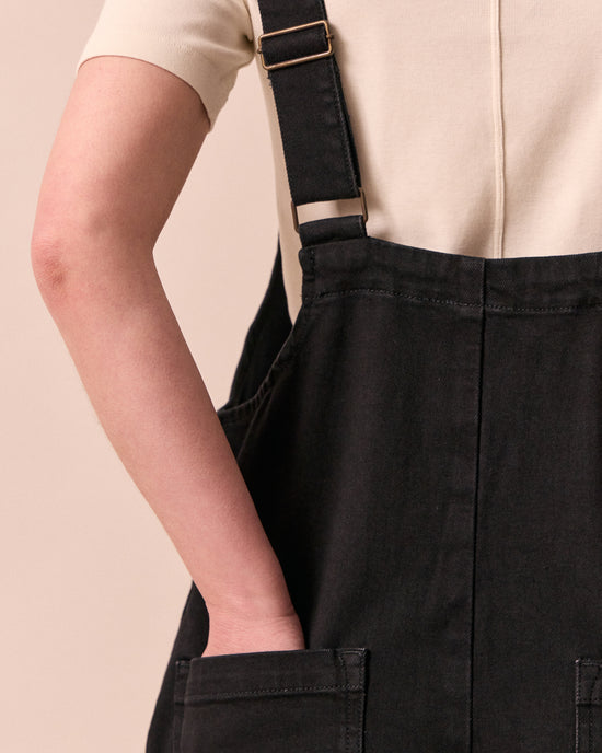 model wears ottie black denim jumpsuit