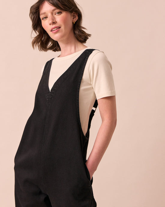 model wears ottie black denim jumpsuit