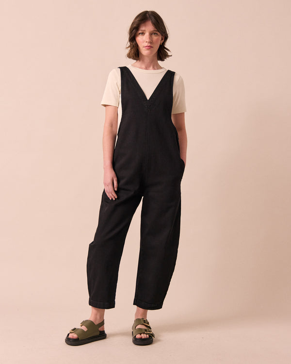model wears ottie black denim jumpsuit