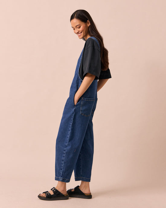 model wears ottie mid blue denim jumpsuit