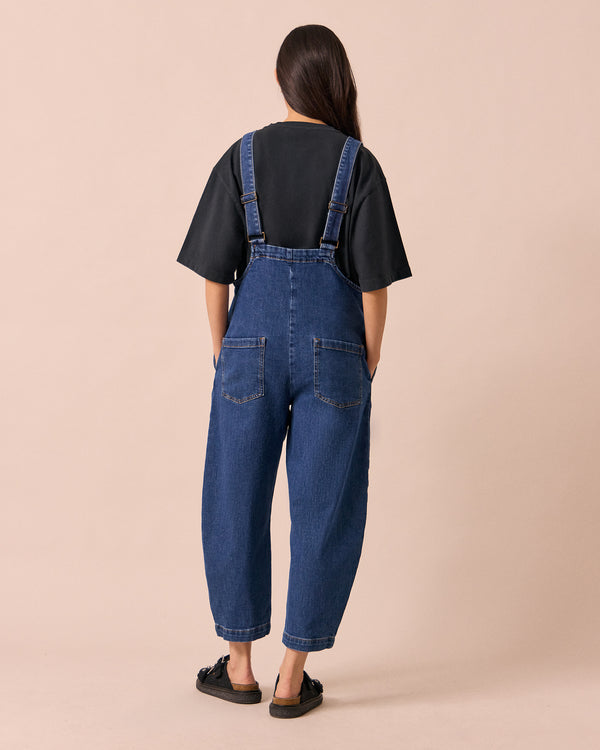 model wears ottie mid blue denim jumpsuit