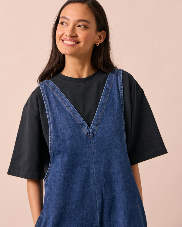 model wears ottie mid blue denim jumpsuit