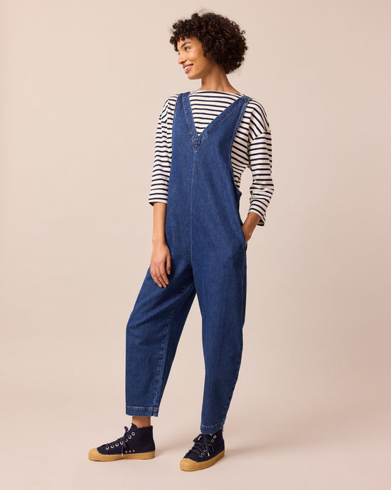 model wears ottie mid blue denim jumpsuit