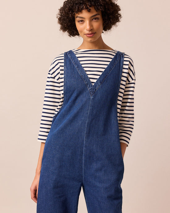 model wears ottie mid blue denim jumpsuit