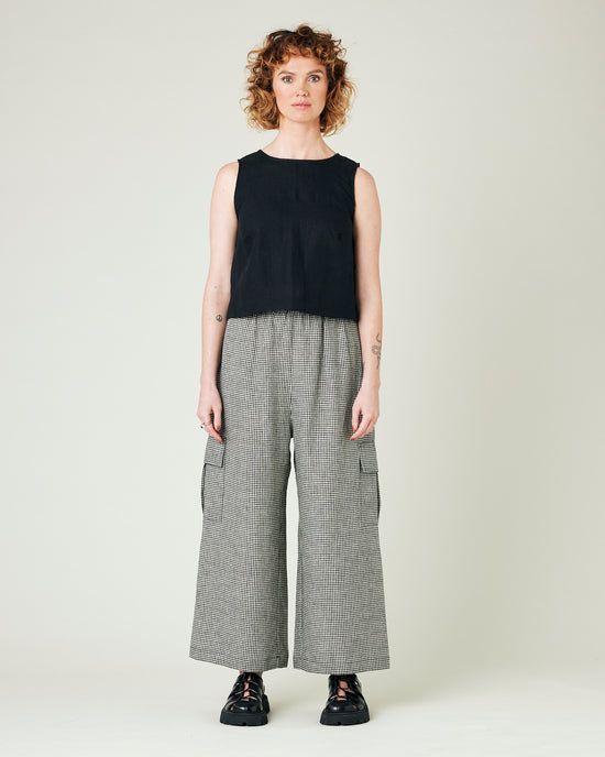 model wears black and stone micro gingham orla trousers