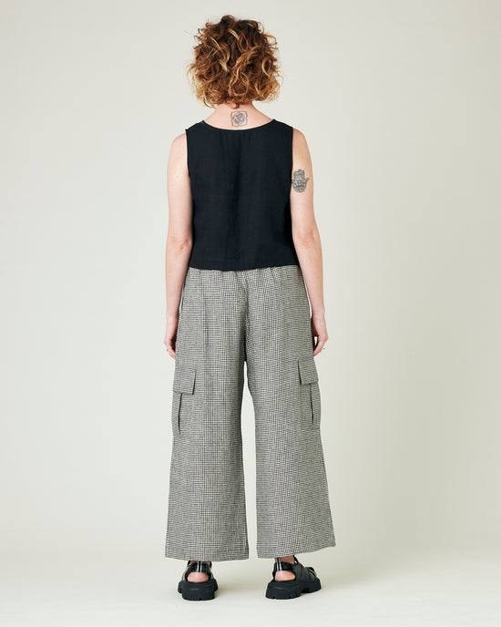 model wears black and stone micro gingham orla trousers