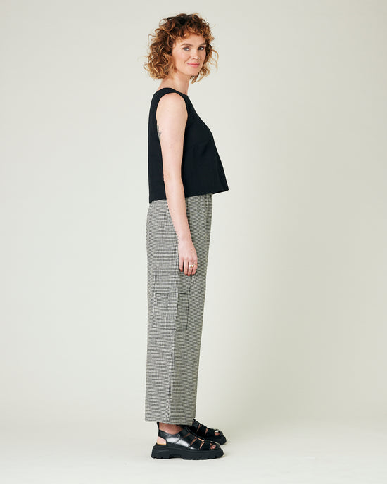 model wears black and stone micro gingham orla trousers