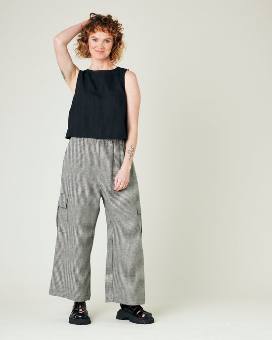 model wears black and stone micro gingham orla trousers