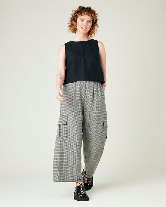 model wears black and stone micro gingham orla trousers