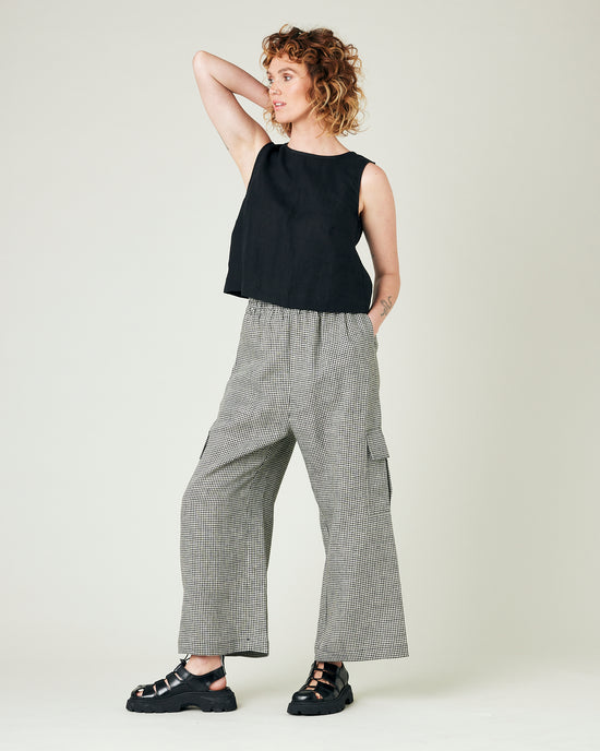 model wears black and stone micro gingham orla trousers