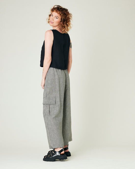 model wears black and stone micro gingham orla trousers