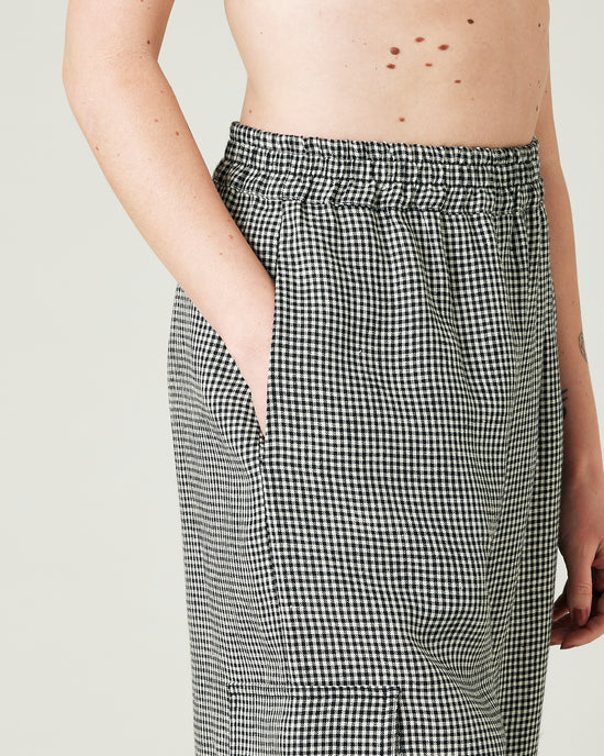 model wears black and stone micro gingham orla trousers