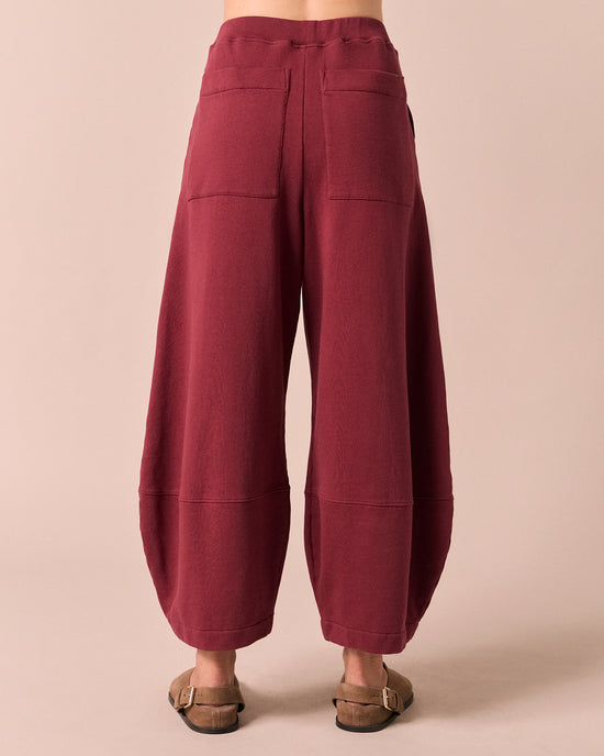 model wears pascale washed berry jersey trousers back
