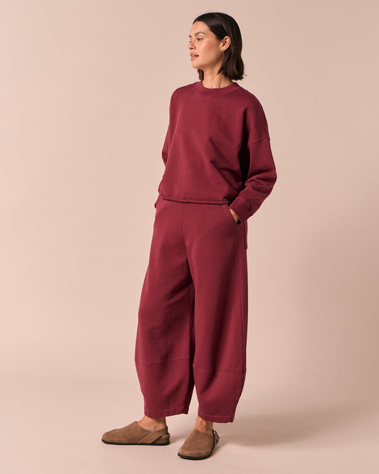 model wears pascale washed berry jersey trousers left