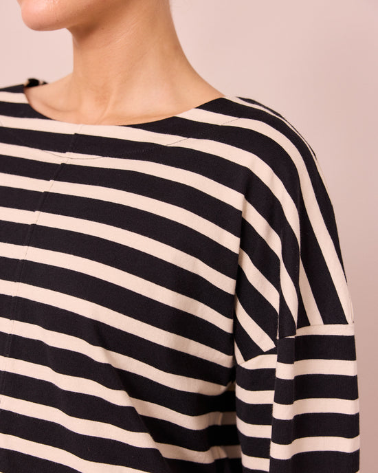 model wears peggy black and white stripe top