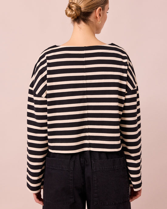 model wears peggy black and white stripe top