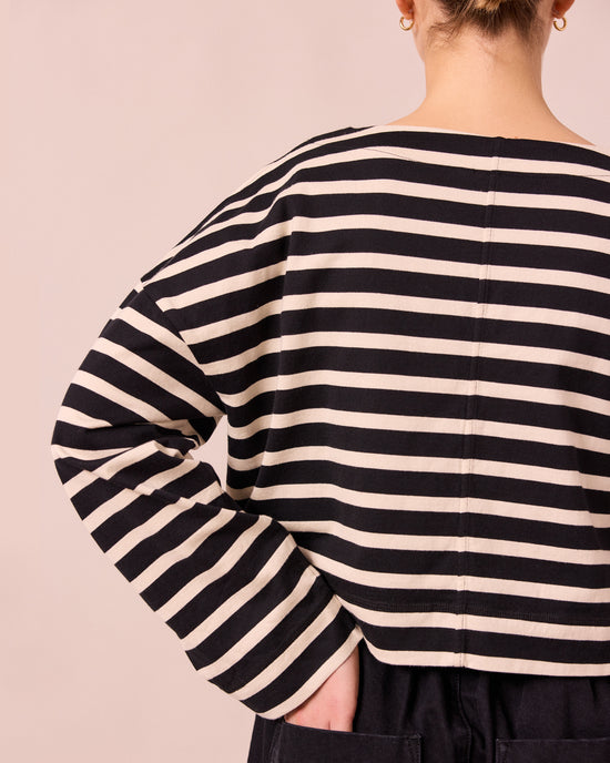 model wears peggy black and white stripe top