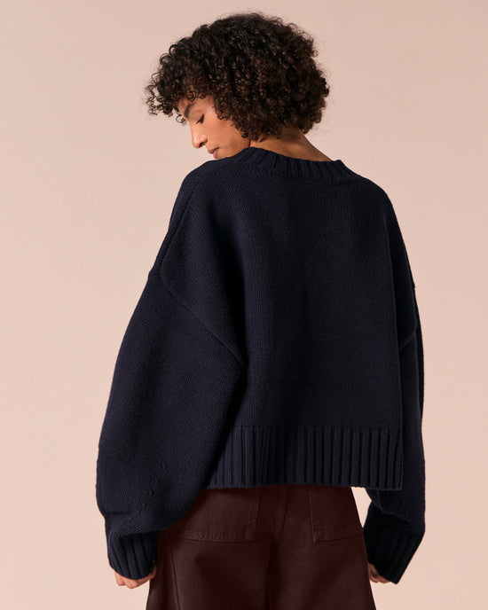 model wears phoebe navy knitted jumper