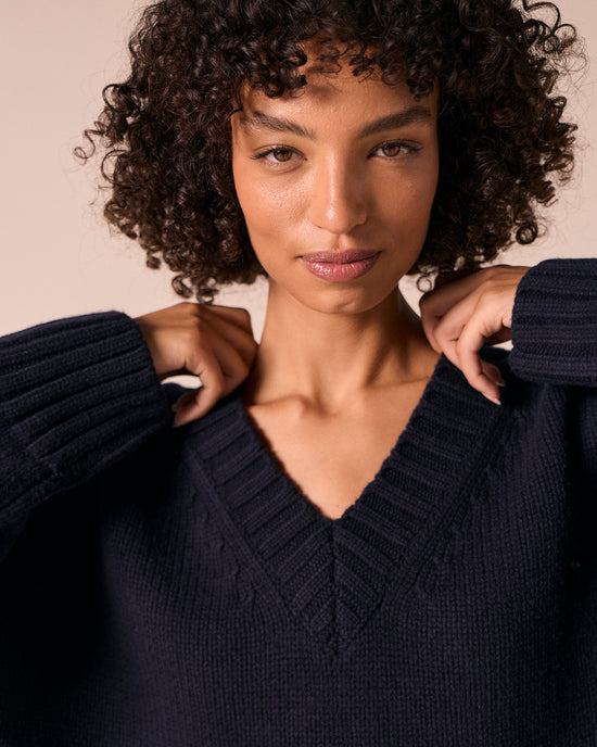 model wears phoebe navy knitted jumper