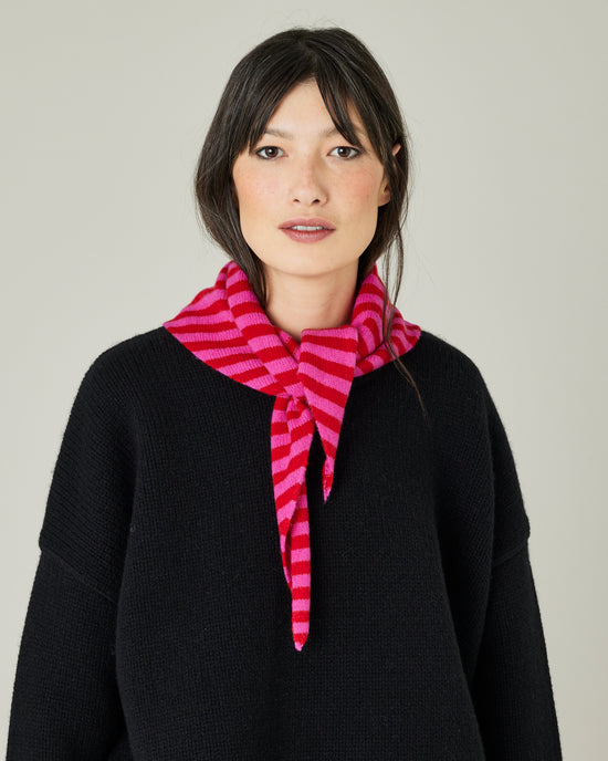 model wears pink and red stripe knitted neckerchief