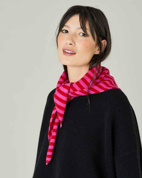 model wears pink and red stripe knitted neckerchief