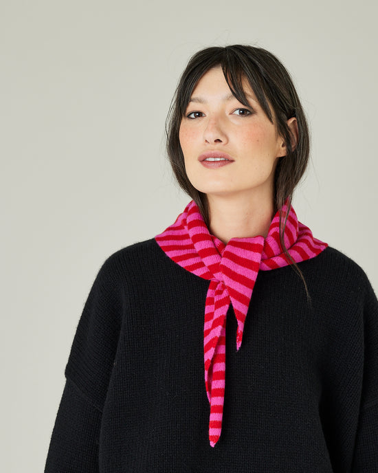 model wears pink and red stripe knitted neckerchief