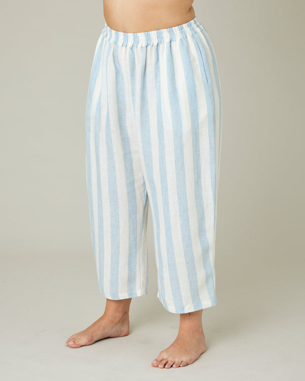 model wears sky blue stripe ultimate pj trousers left