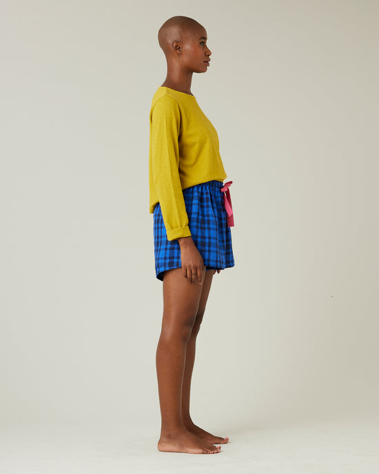 model wears indigo check bed shorts