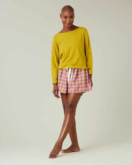 model wears pink and green check bed shorts