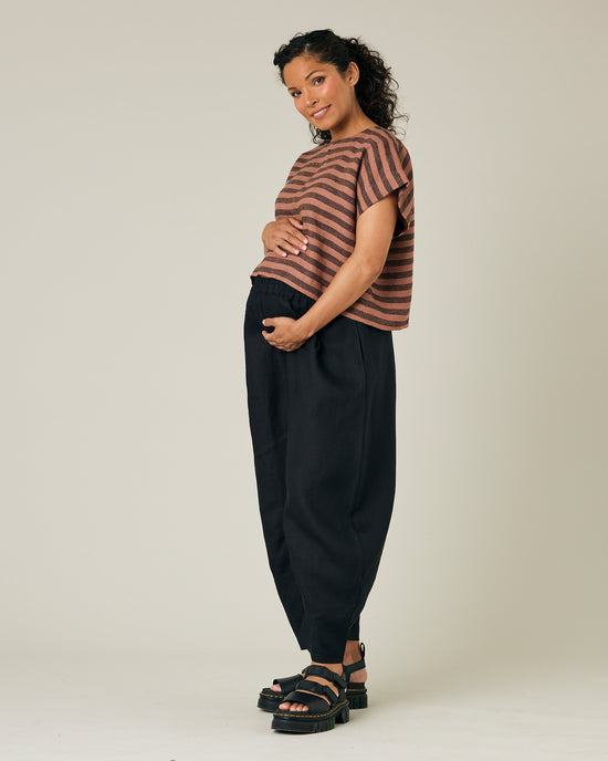 pregnant model wears biscuit stripe linen polly top 