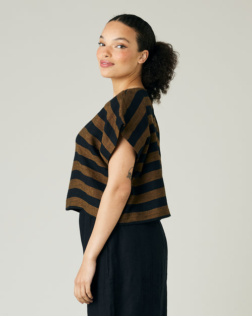 model wears rust stripe linen polly top