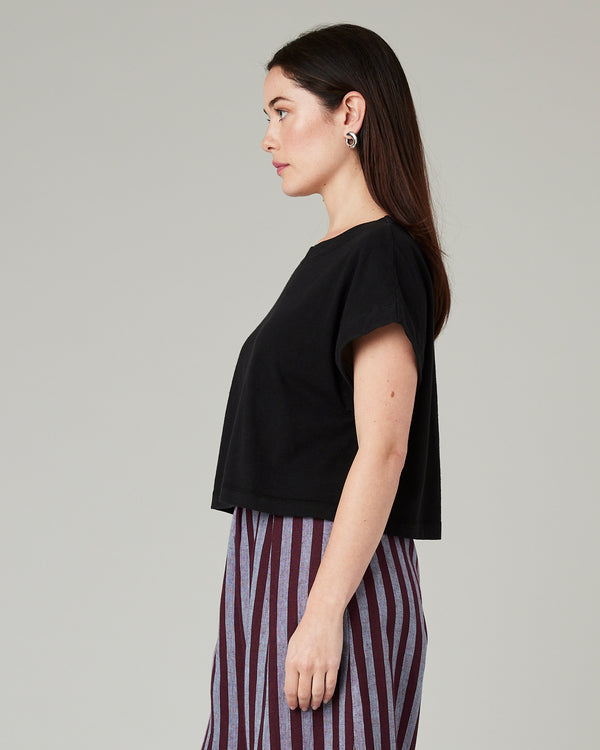 model wears black jersey polly top