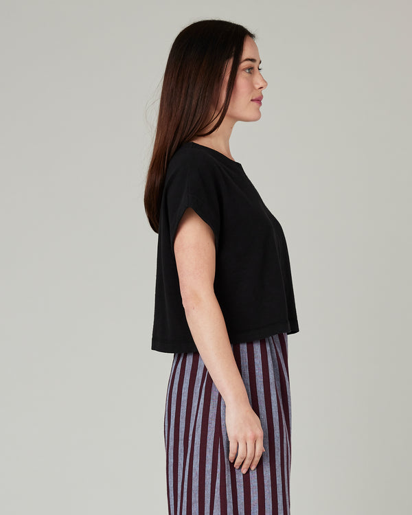 model wears black jersey polly top