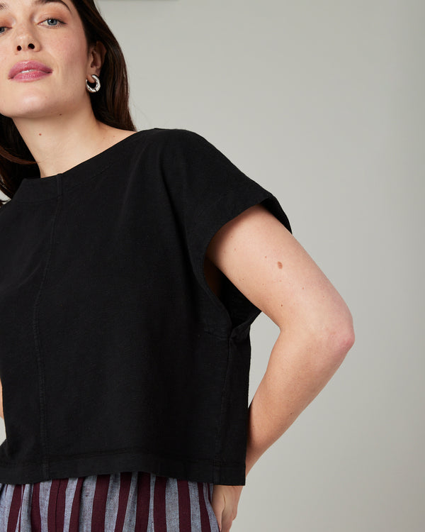 model wears black jersey polly top