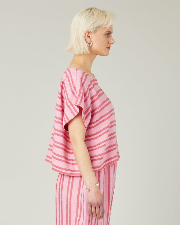 model wears blossom stripe linen polly top