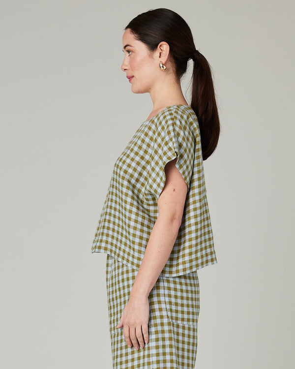 model wears meadow check linen polly top