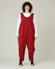 model wears cherry red poppy jumpsuit